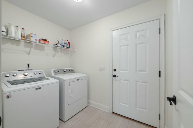 washroom with washer and clothes dryer