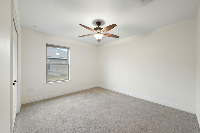 empty room featuring carpet and ceiling fan