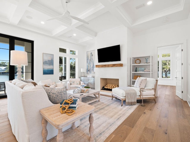 59 Arboleda Dr, Santa Rosa Beach, FL 32459 - living area featuring light wood finished floors, a fireplace, and beam ceiling