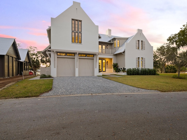 59 Arboleda Dr, Santa Rosa Beach, FL 32459 - view of front of house featuring a garage, a front yard, decorative driveway, and a chimney