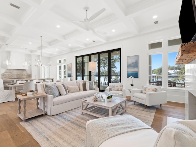 59 Arboleda Dr, Santa Rosa Beach, FL 32459 - living area with visible vents, a wealth of natural light, light wood-type flooring, and beam ceiling