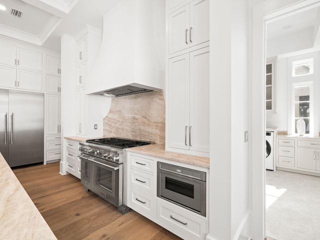 59 Arboleda Dr, Santa Rosa Beach, FL 32459 - kitchen with white cabinetry, high quality appliances, custom exhaust hood, and light countertops