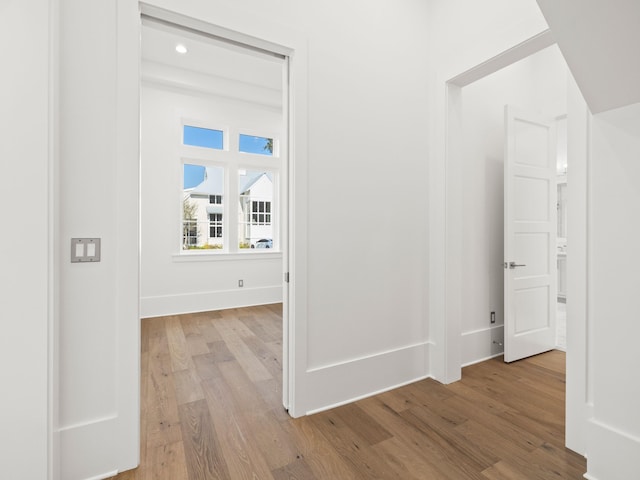 59 Arboleda Dr, Santa Rosa Beach, FL 32459 - hall featuring light wood-style flooring, baseboards, and recessed lighting