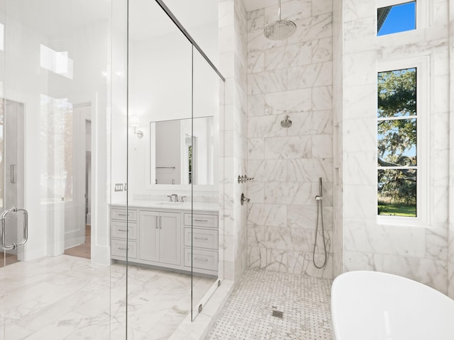 59 Arboleda Dr, Santa Rosa Beach, FL 32459 - full bath with plenty of natural light, tiled shower, marble finish floor, vanity, and a freestanding tub