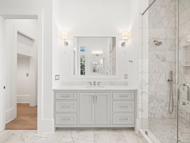59 Arboleda Dr, Santa Rosa Beach, FL 32459 - bathroom featuring marble finish floor, baseboards, a shower stall, and vanity