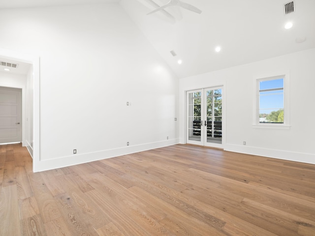 59 Arboleda Dr, Santa Rosa Beach, FL 32459 - unfurnished living room featuring light wood-type flooring, high vaulted ceiling, visible vents, and french doors