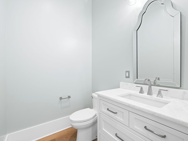 59 Arboleda Dr, Santa Rosa Beach, FL 32459 - bathroom featuring wood finished floors, vanity, toilet, and baseboards