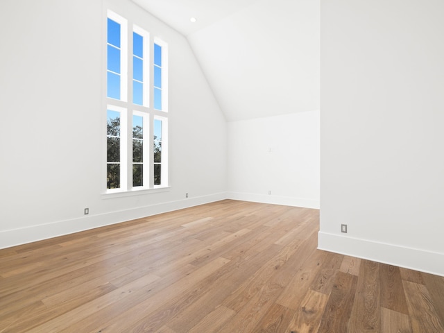 59 Arboleda Dr, Santa Rosa Beach, FL 32459 - additional living space with lofted ceiling, light wood-style flooring, and baseboards