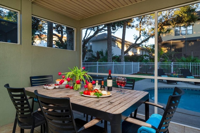 view of patio / terrace with a fenced in pool