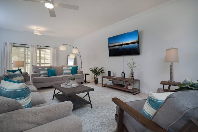 carpeted living room featuring crown molding and ceiling fan