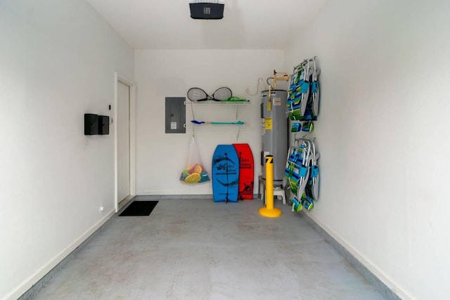 garage with a garage door opener, electric panel, and electric water heater