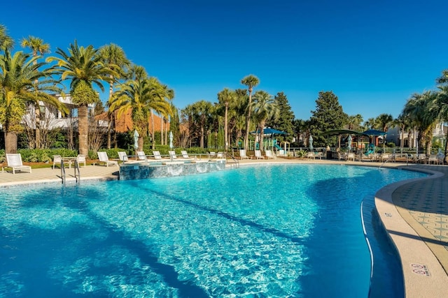 view of swimming pool with a patio area