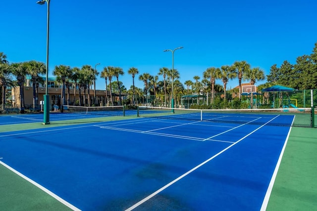 view of sport court with basketball hoop