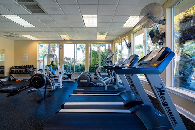 exercise room with a drop ceiling