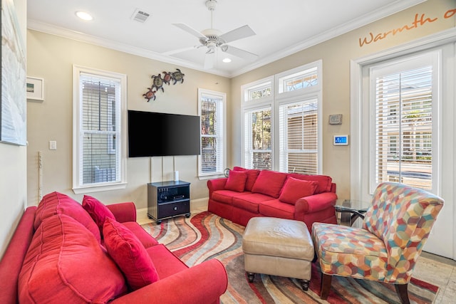 living area featuring plenty of natural light, visible vents, ornamental molding, and ceiling fan