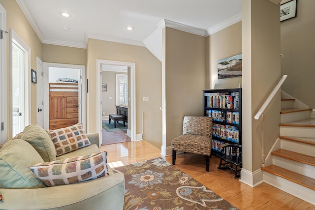 interior space featuring crown molding, stairs, wood finished floors, and recessed lighting