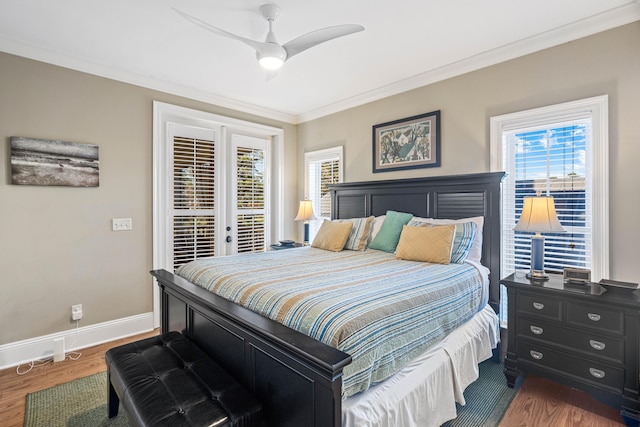 bedroom with access to exterior, multiple windows, ornamental molding, and wood finished floors