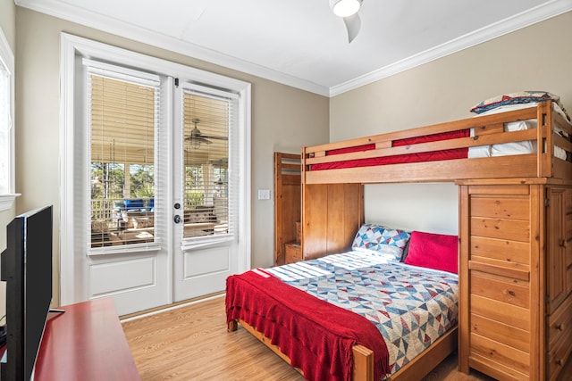 bedroom with access to outside, ornamental molding, wood finished floors, and a ceiling fan