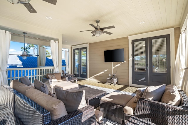 view of patio featuring an outdoor hangout area, a ceiling fan, and french doors