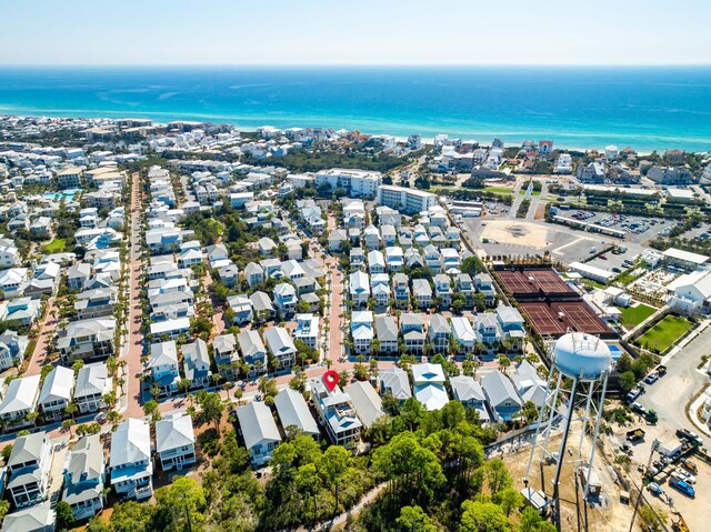 drone / aerial view featuring a water view and a residential view