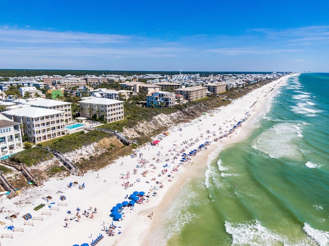 bird's eye view featuring a view of the beach and a water view