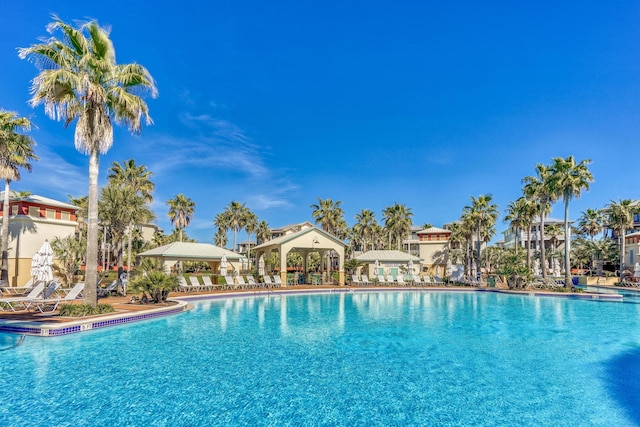 community pool with a gazebo