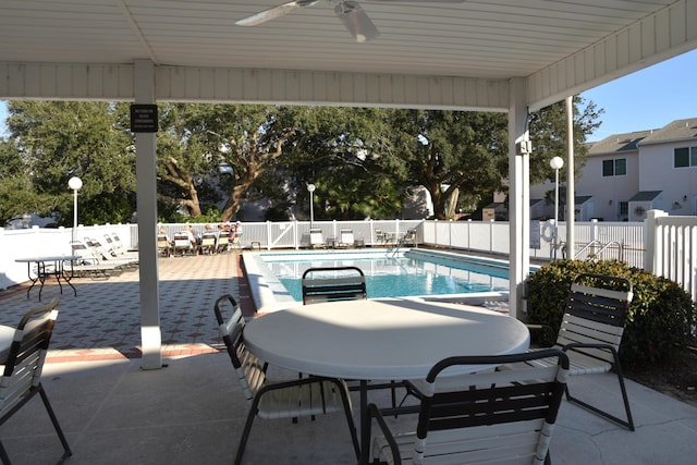 view of pool featuring a patio and ceiling fan