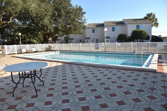 view of swimming pool featuring a patio