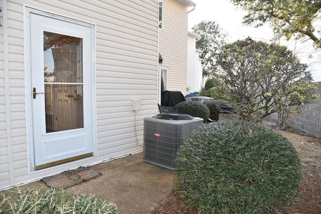 view of side of home with cooling unit