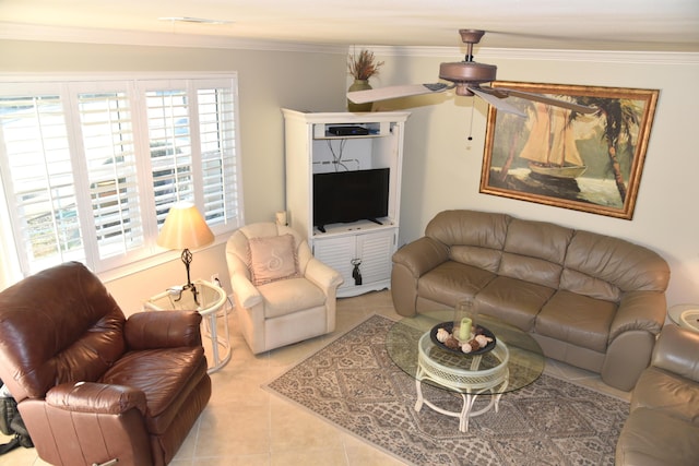 living room featuring ornamental molding, light tile patterned floors, and ceiling fan