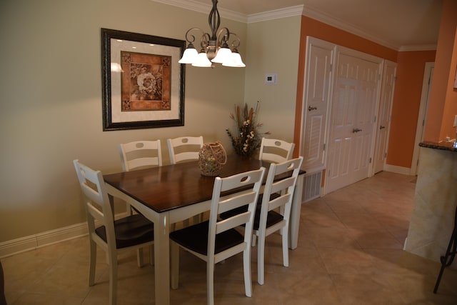 dining area featuring crown molding, light tile patterned flooring, and an inviting chandelier