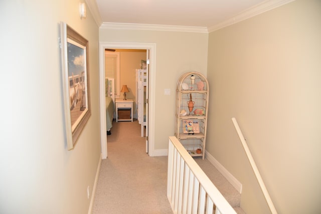 hall with crown molding and light carpet