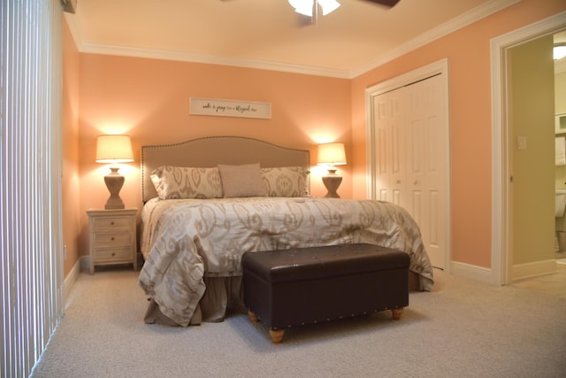 bedroom with light carpet, ornamental molding, a closet, and ceiling fan