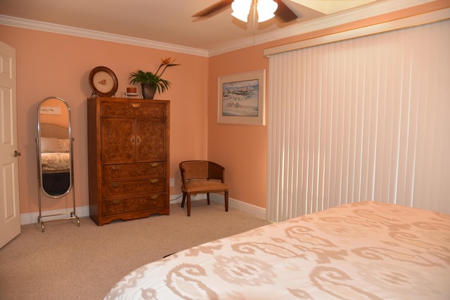 bedroom featuring ornamental molding, light carpet, and ceiling fan