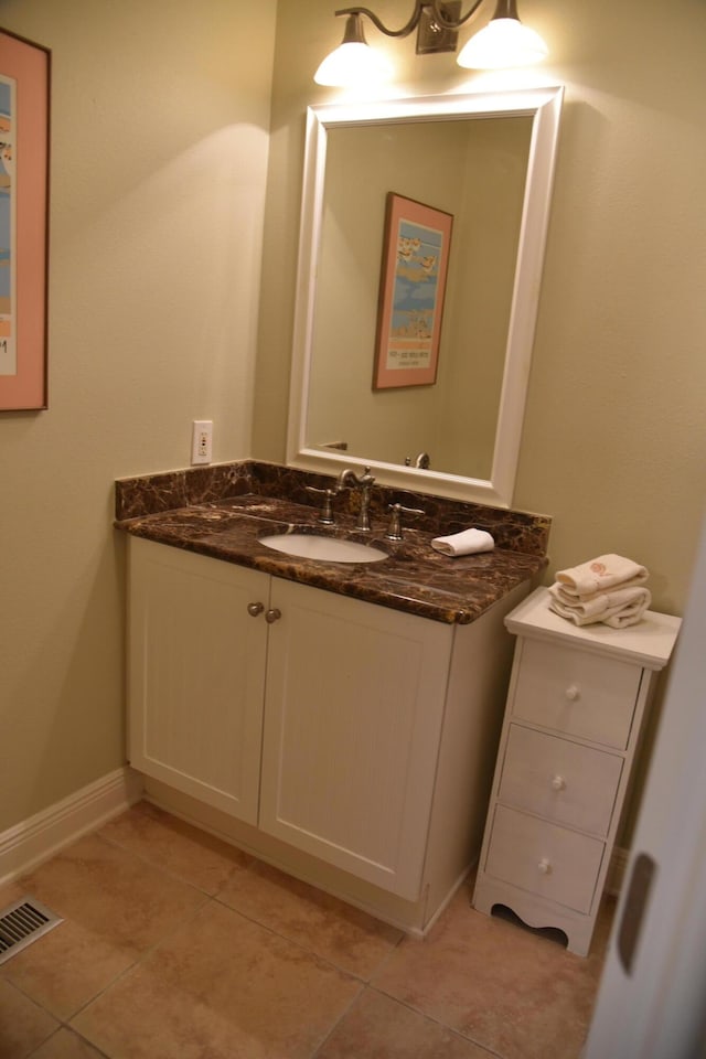 bathroom featuring tile patterned flooring and vanity