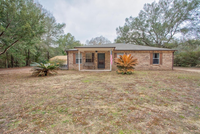 rear view of house with a yard