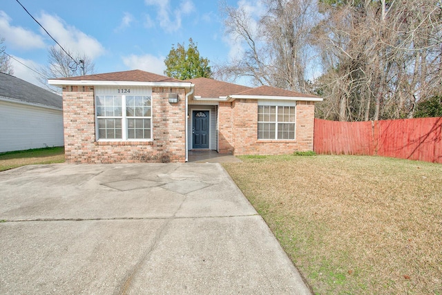 ranch-style house with a front lawn