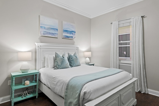 bedroom with baseboards, dark wood-type flooring, and crown molding