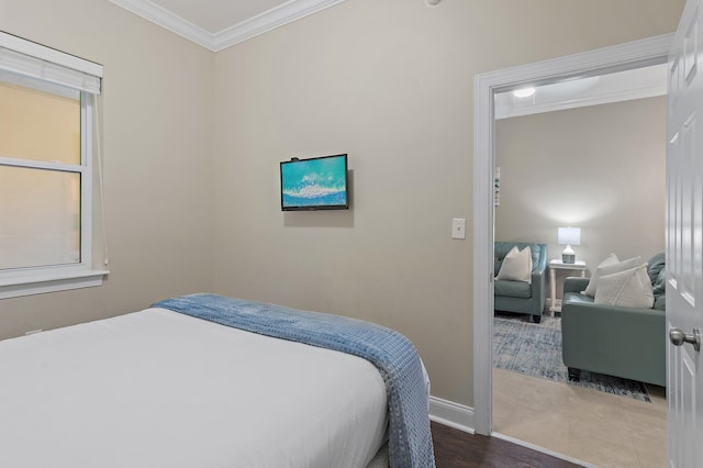 bedroom featuring ornamental molding and baseboards