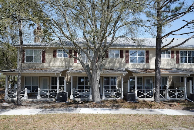 view of front of home featuring central air condition unit and a porch