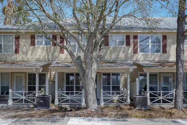 view of property with central AC unit and a porch