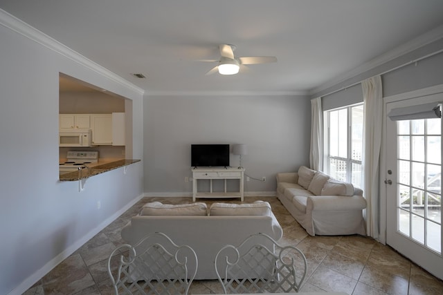 living area with visible vents, baseboards, ceiling fan, and ornamental molding