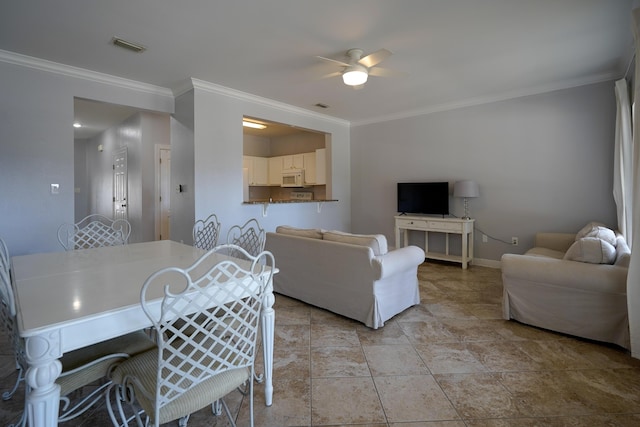 living room with visible vents, baseboards, a ceiling fan, and crown molding