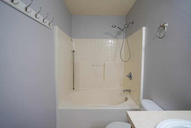 full bath featuring toilet, vanity, and shower / tub combination