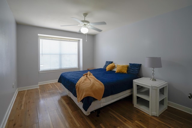 bedroom with hardwood / wood-style flooring, baseboards, and ceiling fan