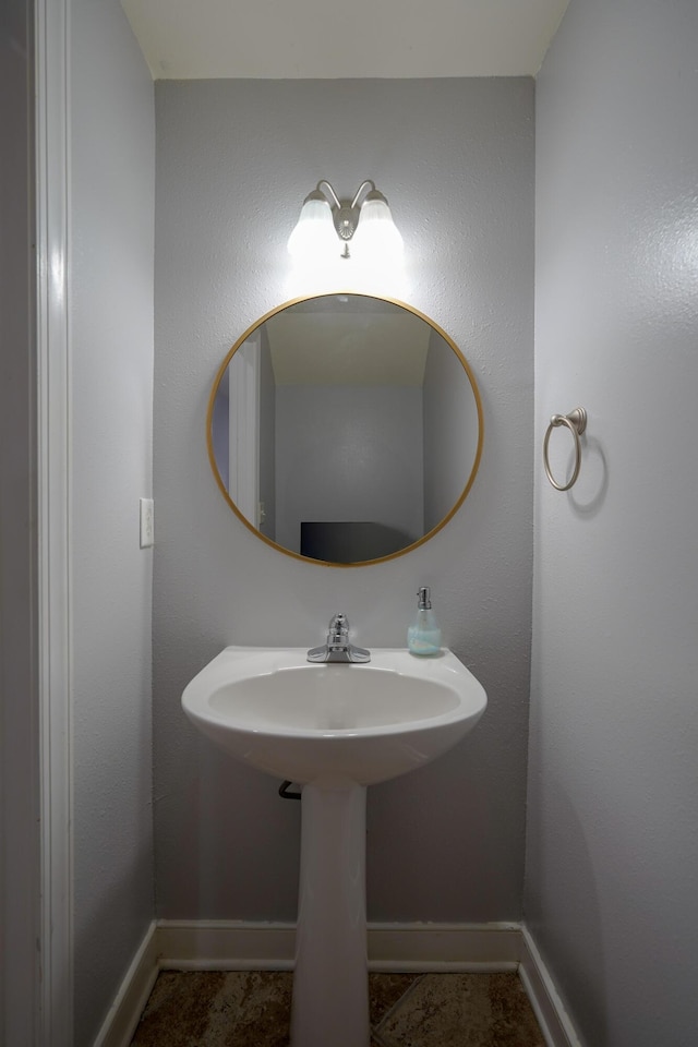 bathroom featuring baseboards