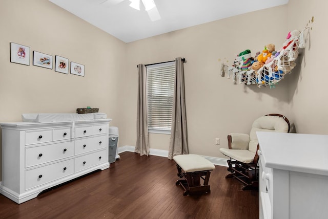 sitting room with ceiling fan, dark wood-style flooring, and baseboards