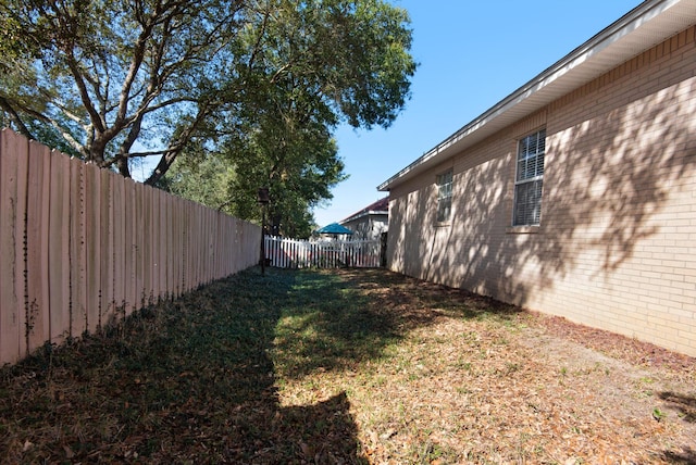 view of yard featuring a fenced backyard