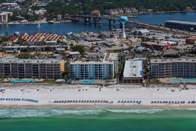 birds eye view of property with a view of the beach and a water view