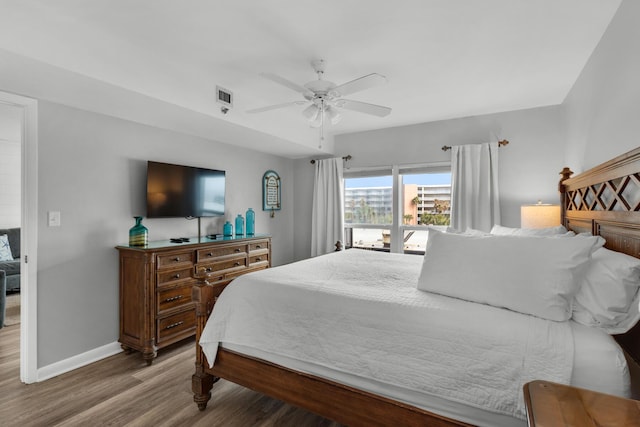 bedroom featuring wood-type flooring and ceiling fan